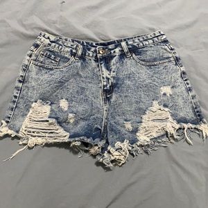 Ripped, high-waisted denim shorts